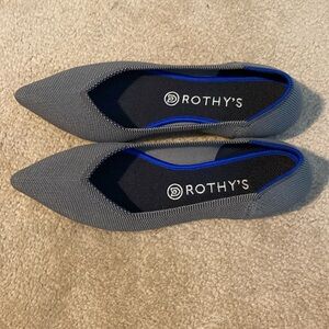 Black and grey Rothy flats.